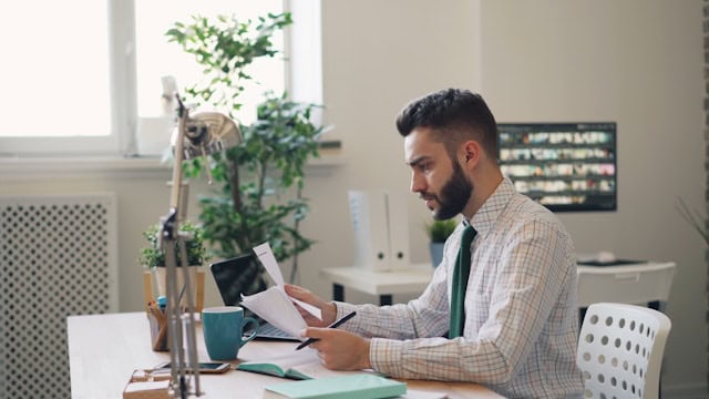 guy checking his notes